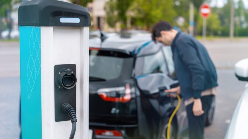 man plugging charger